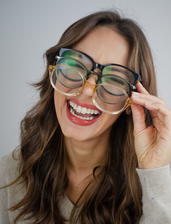 Woman using multiple eye glasses.